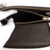Zipped coin pocket opened inside the wallet
