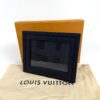 The frame standing on its dust bag in front of the orange box