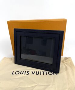 The frame standing on its dust bag in front of the orange box