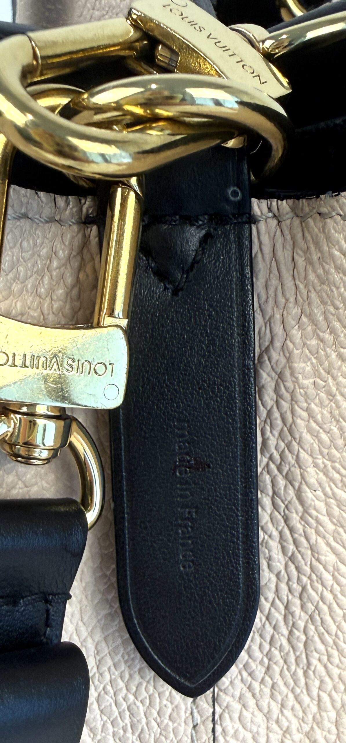 Engraved clasp and Made in France stamp on the strap