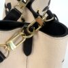 Gold strap clasps and chain links close up