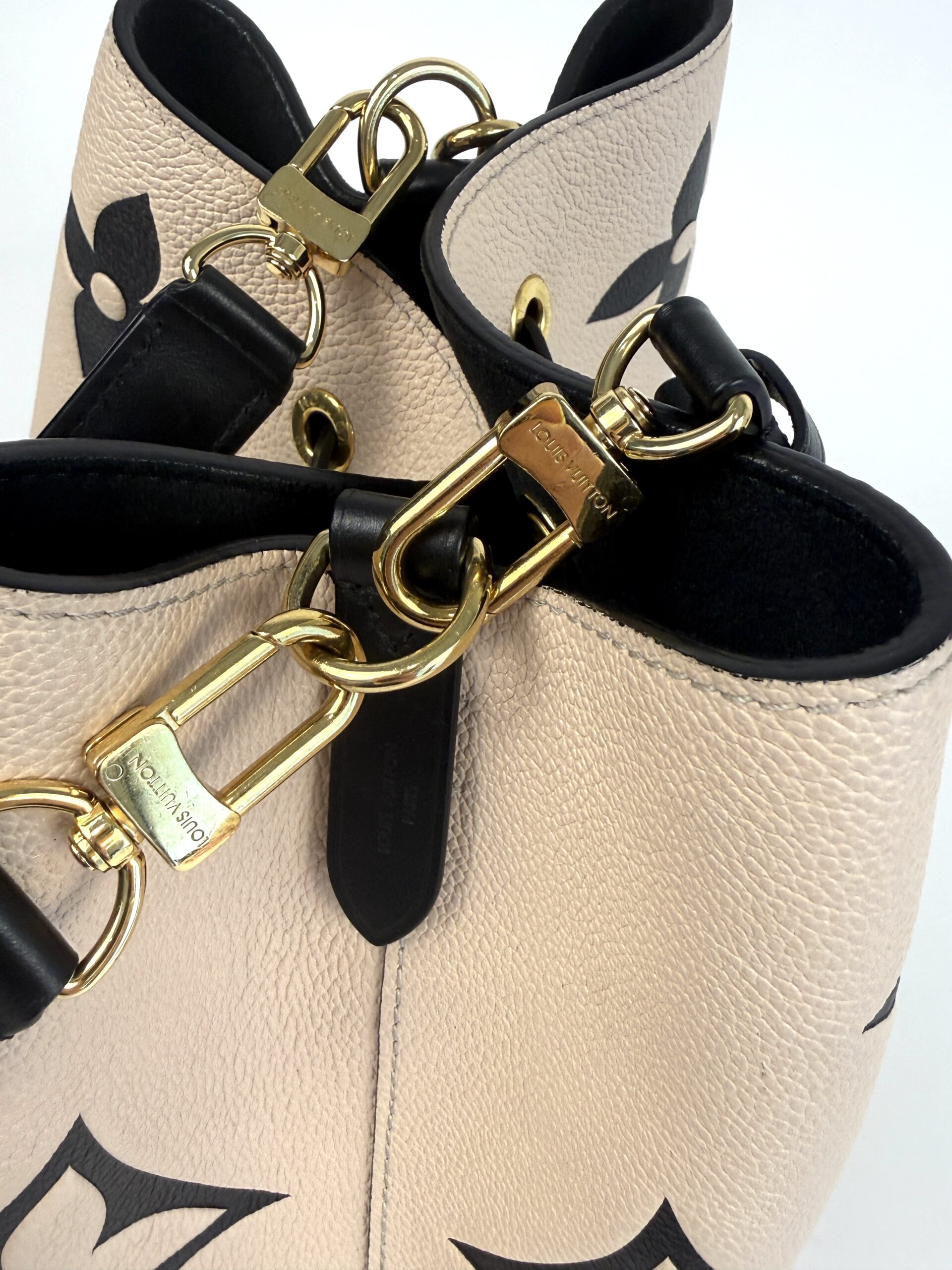 Gold strap clasps and chain links close up