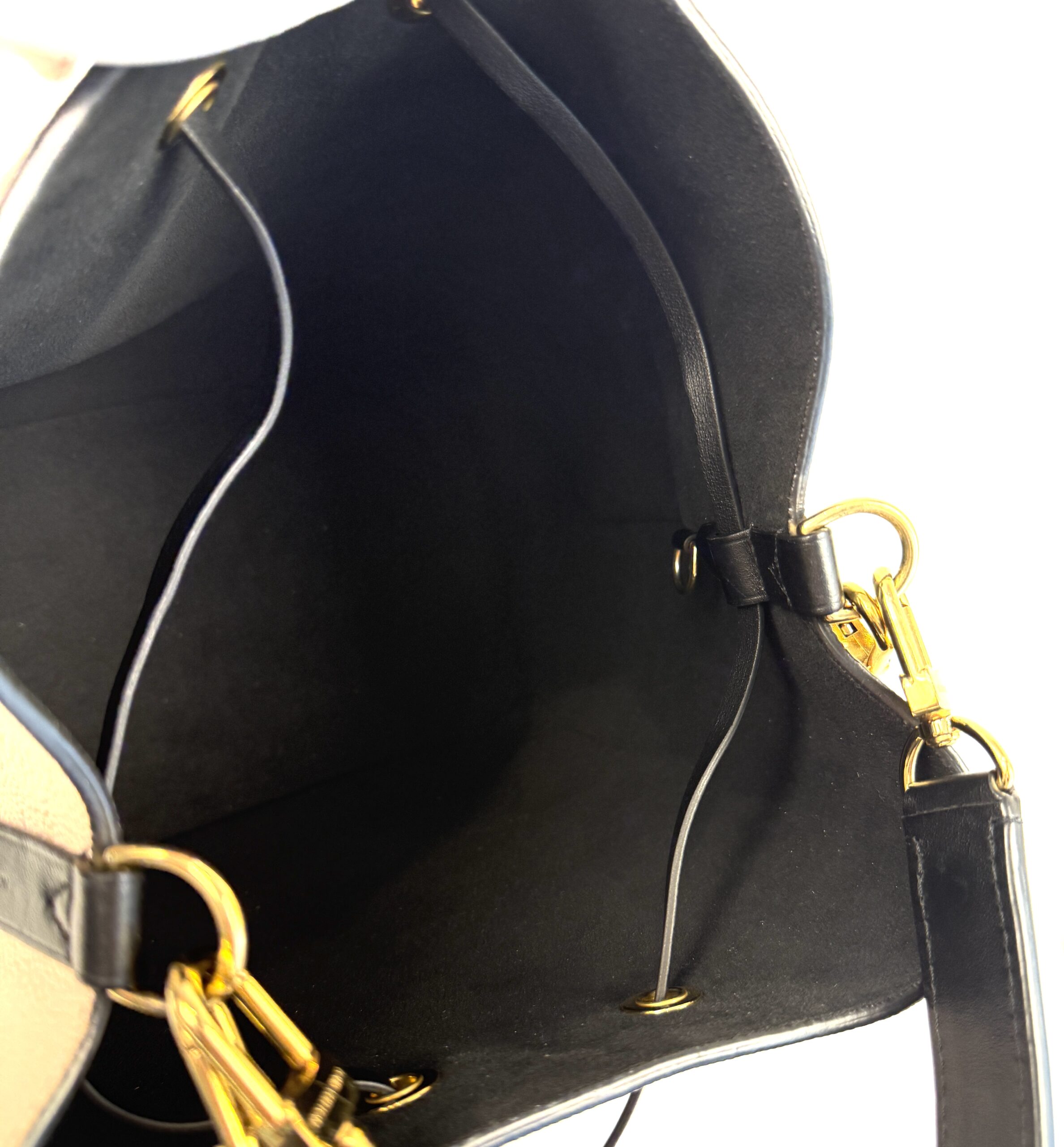 Interior edge with the gold strap clasps