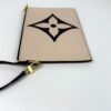 Pochette from an angle with its strap