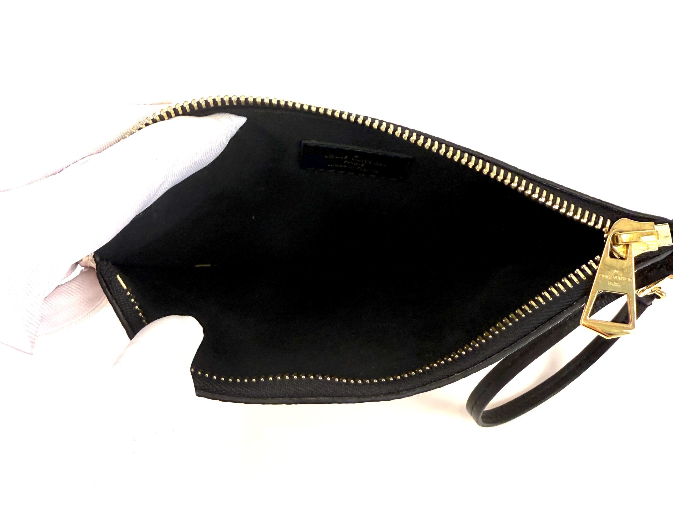 Inside the pochette, black lining