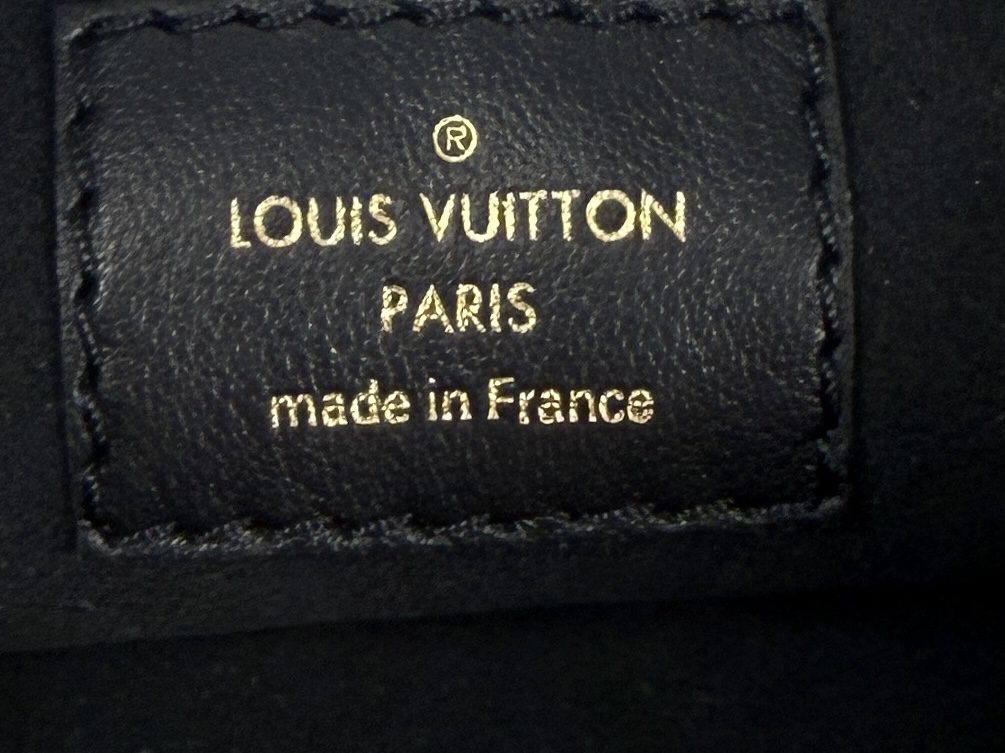 Pochette label reading LOUIS VUITTON PARIS made in France