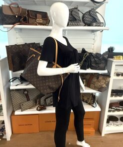 The Neverfull MM styled on a mannequin in the shop