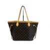 The bag hanging from its vachetta straps