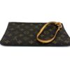 Lying flat with the strap looped over