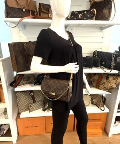 Styled on a mannequin, worn crossbody on the leather strap