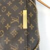 Flap close up with the gold plate and chain