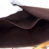 Interior slip pocket in the burgundy microfiber lining