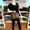Styled on a mannequin, carried in hand with the twilly