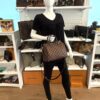 Styled on a mannequin, carried by the handles