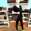 Styled on a mannequin, worn crossbody on the strap