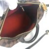 Top zip open showing the red lining, padlock and key