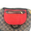 Inside zip pocket on the red lining