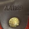 Date code AA1169 stamped on the leather tab