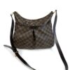 Louis Vuitton Damier Ebene Bloomsbury PM Crossbody Bag, front view with the leather shoulder strap